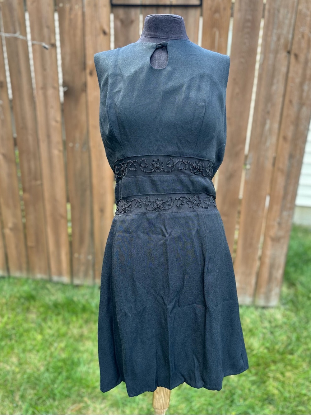 Vintage Black Sleeveless Mini Dress with Embroidered Waist Detail